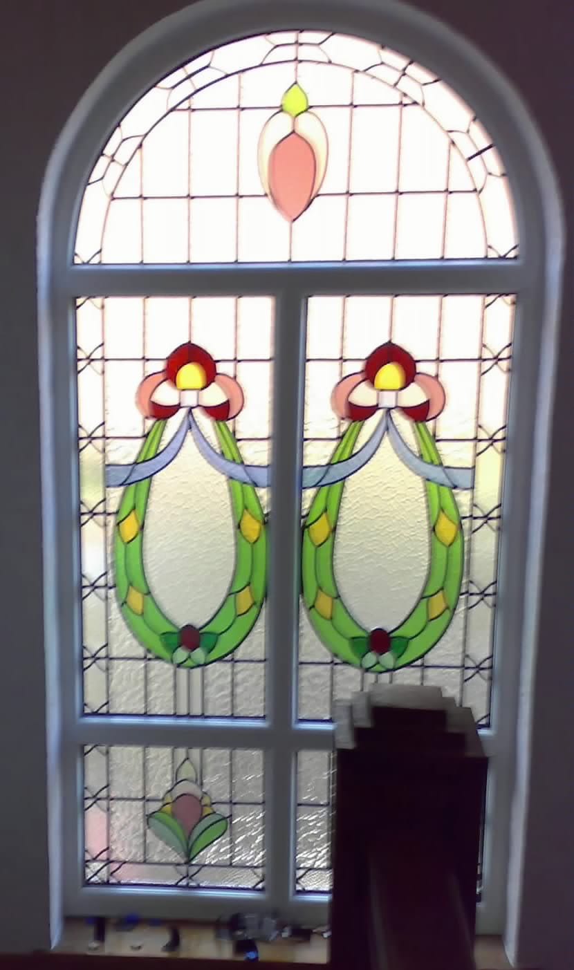 Bespoke arched stained glass window with Art Nouveau floral design, Liverpool