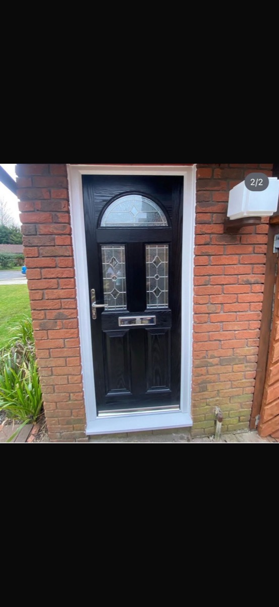 Black composite door with arched stained glass fanlight, Liverpool