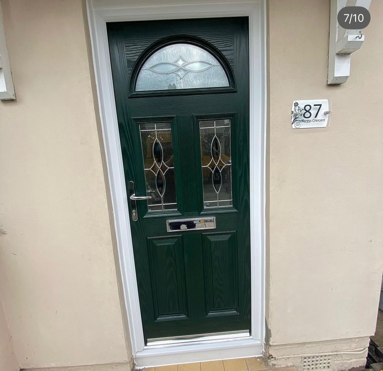 Bespoke green timber front door with arched fanlight and leaded glass panels