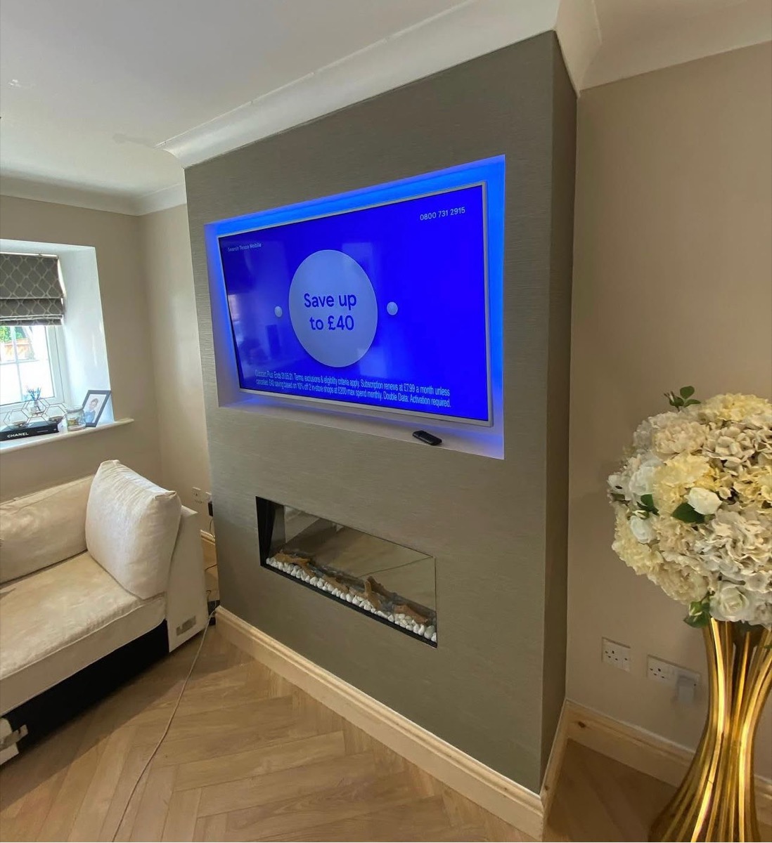 Grey fitted media wall with bio ethanol fireplace and floating TV, Liverpool