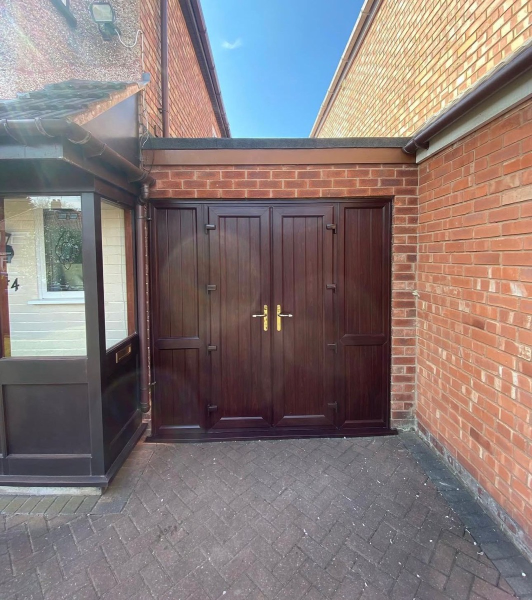 Mahogany-stained bespoke double timber doors with brass handles