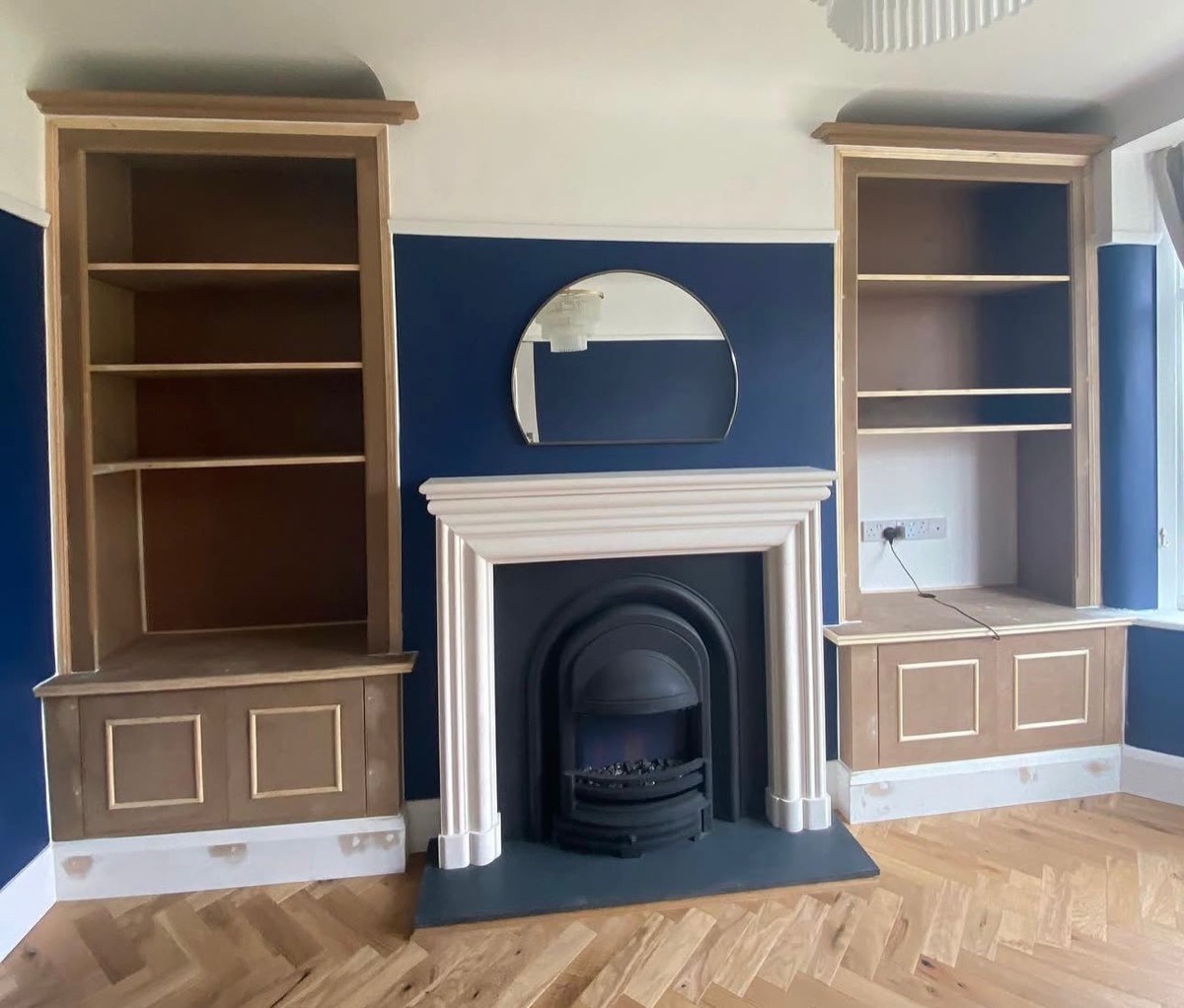 Bespoke oak alcove units flanking period Victorian fireplace, Liverpool
