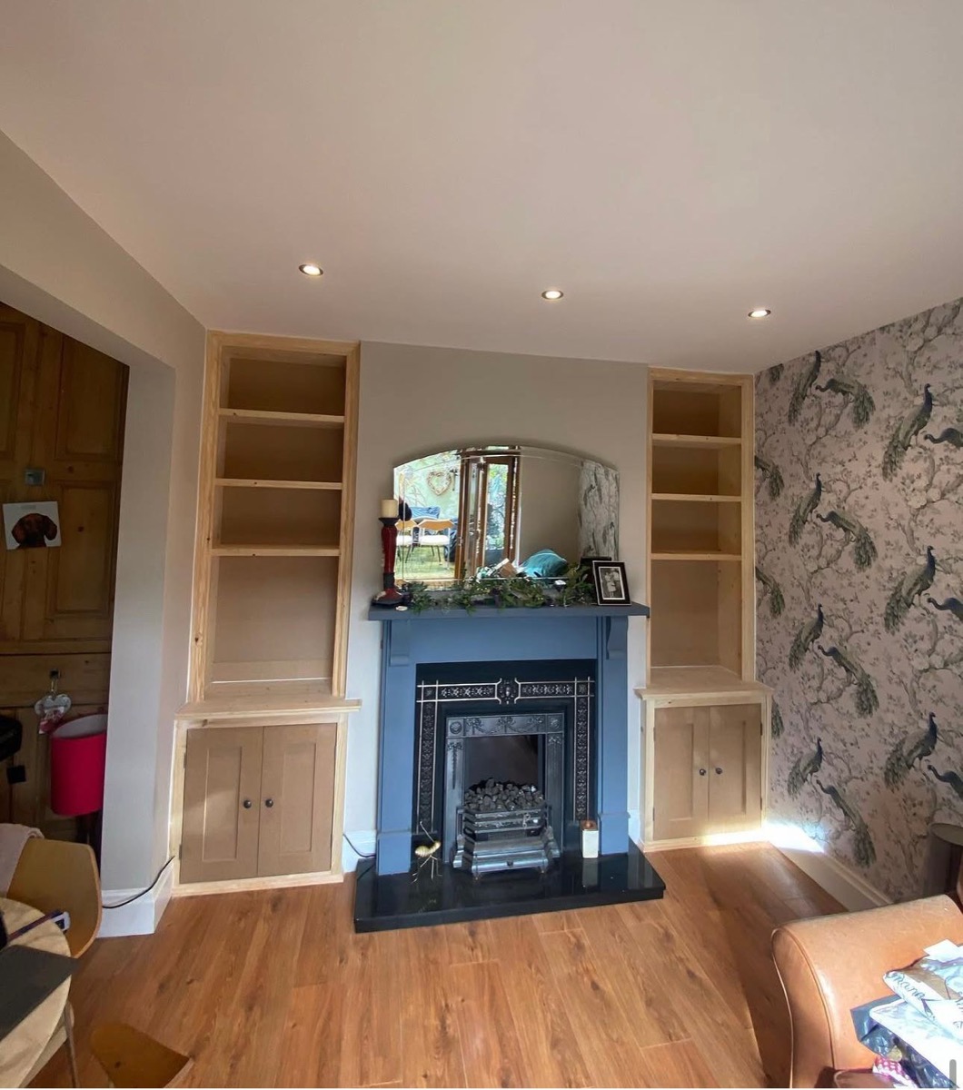 Pine alcove units flanking cast-iron period fireplace, Liverpool
