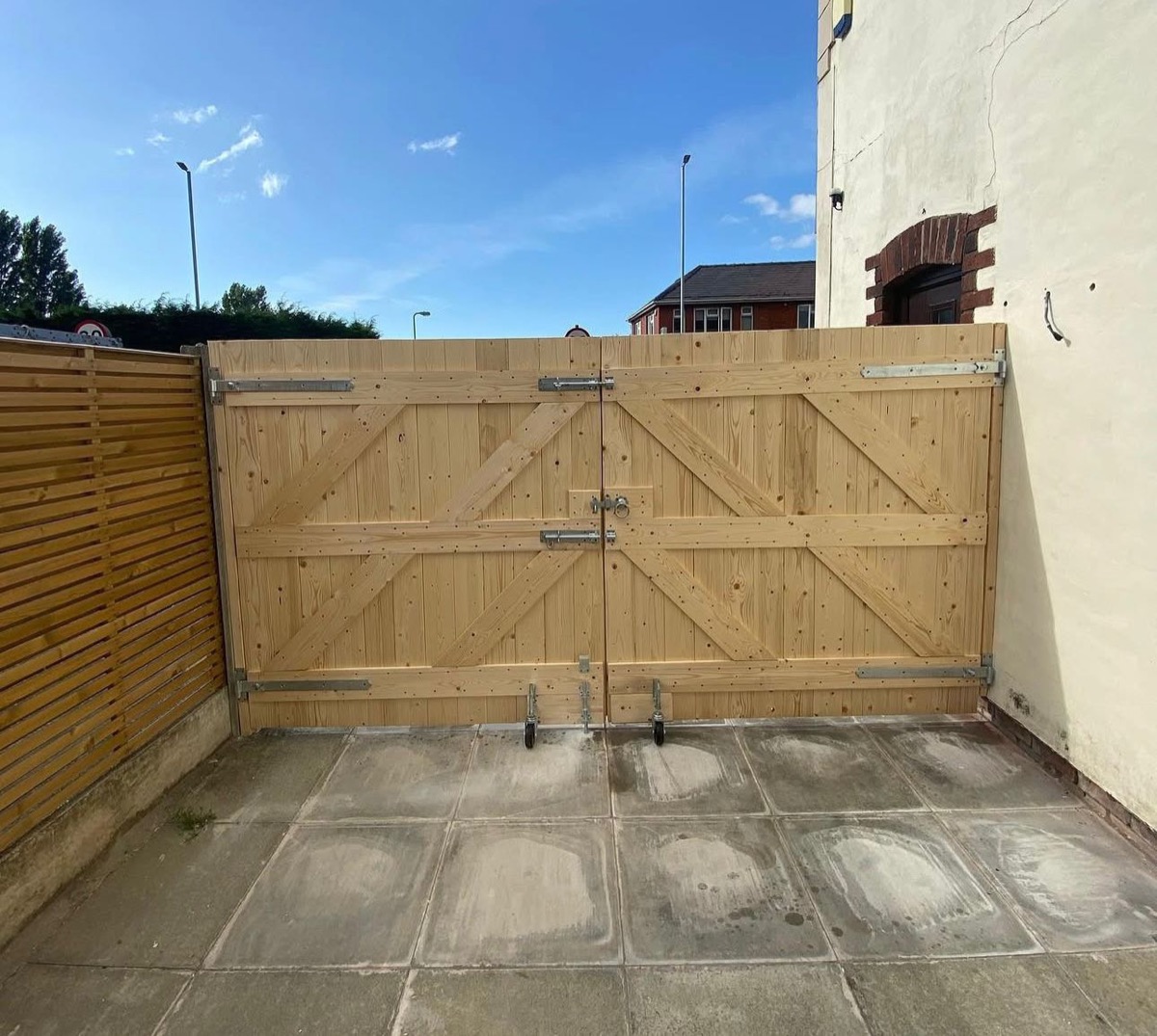 Pine double driveway gates showing traditional cross bracing, Liverpool