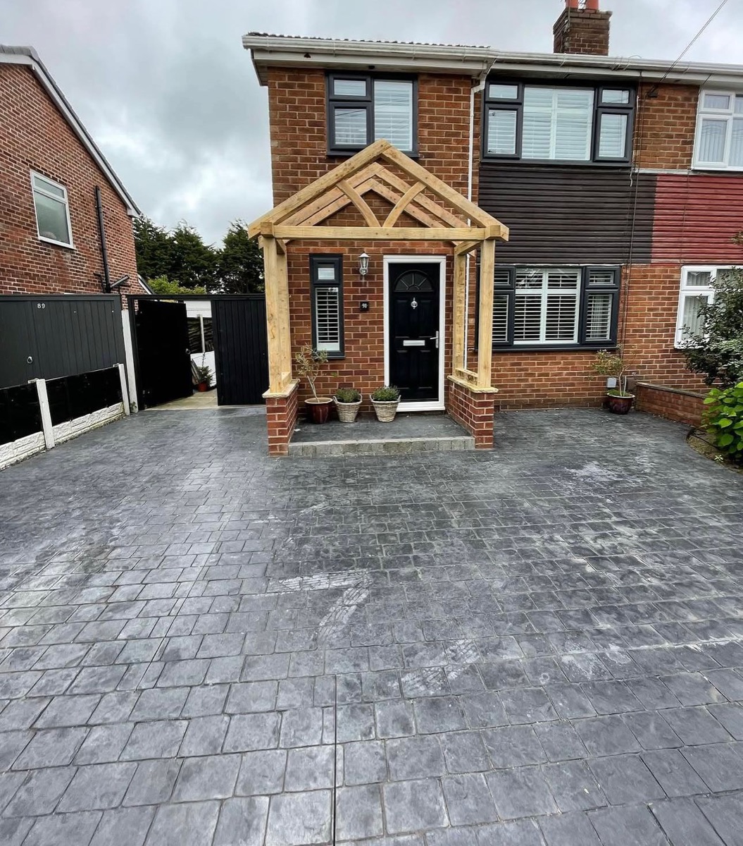 White timber porch canopy viewed from street with decorative railing, Liverpool