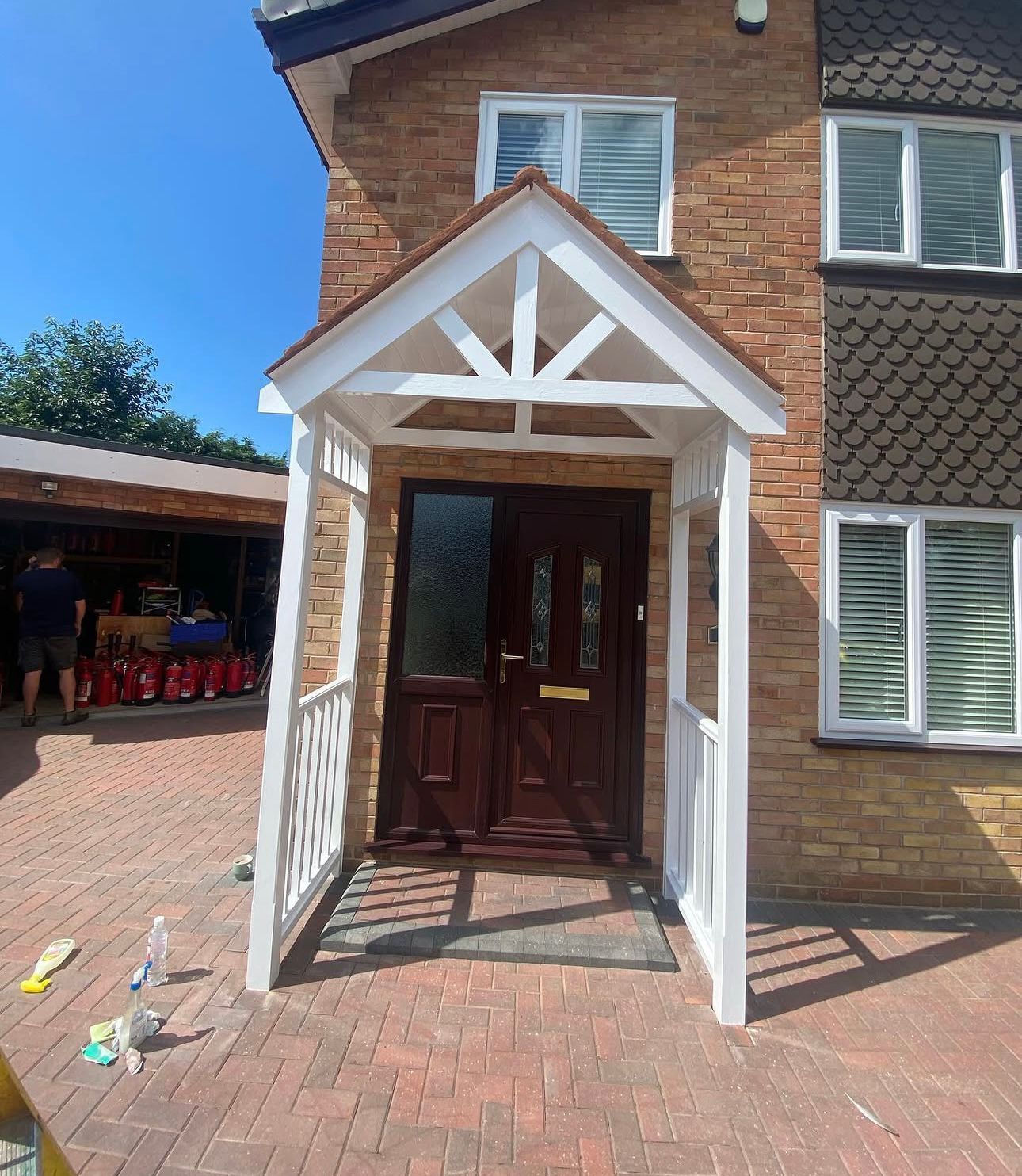 Handcrafted white timber porch canopy with decorative truss, Liverpool joinery