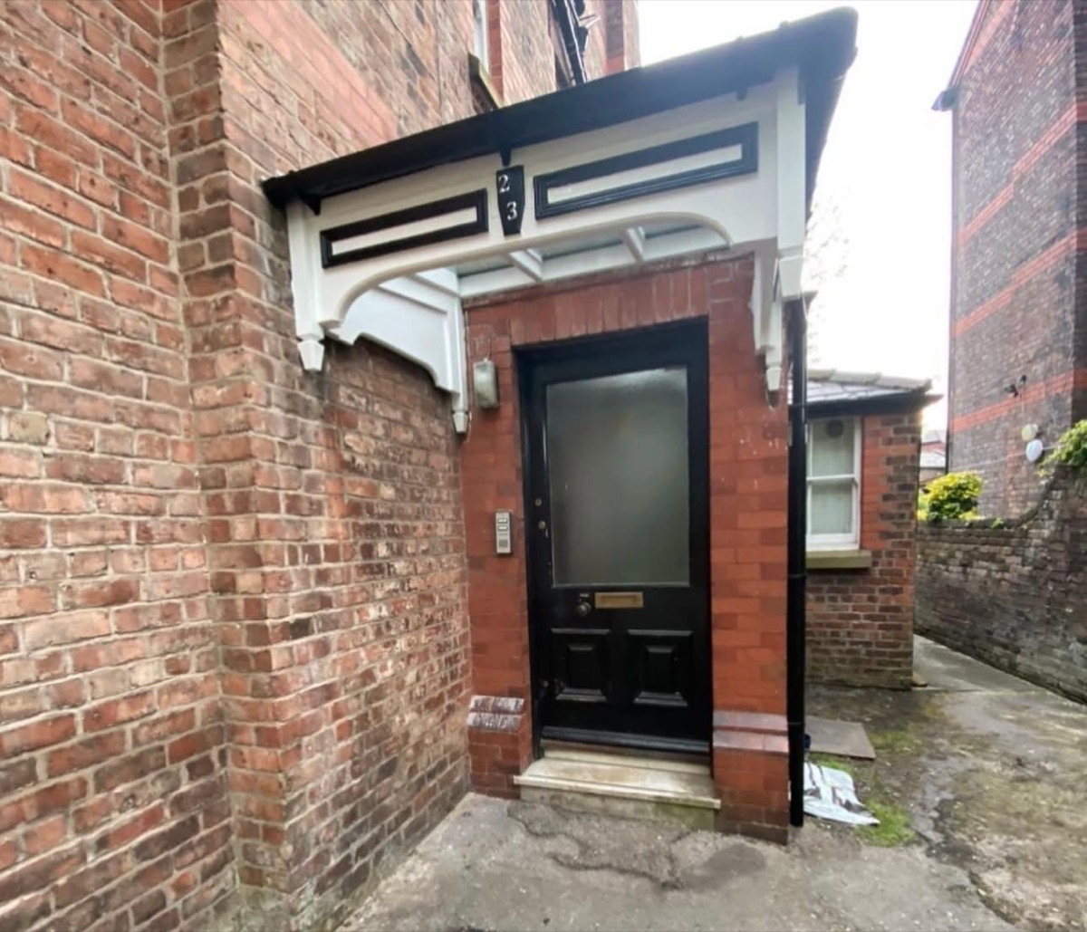 Victorian period door canopy with ornate decorative brackets, Liverpool
